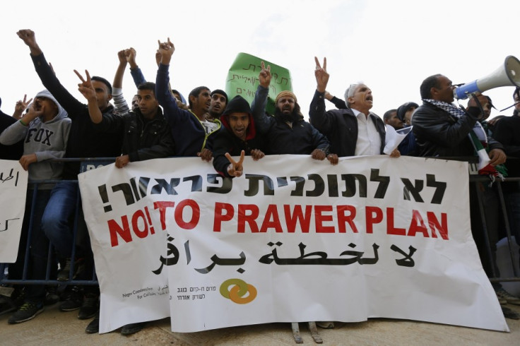 Members of the Bedouin community gesture during a protest outside a court in the southern city of Beersheba