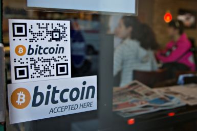 Signs on window advertise a bitcoin ATM machine