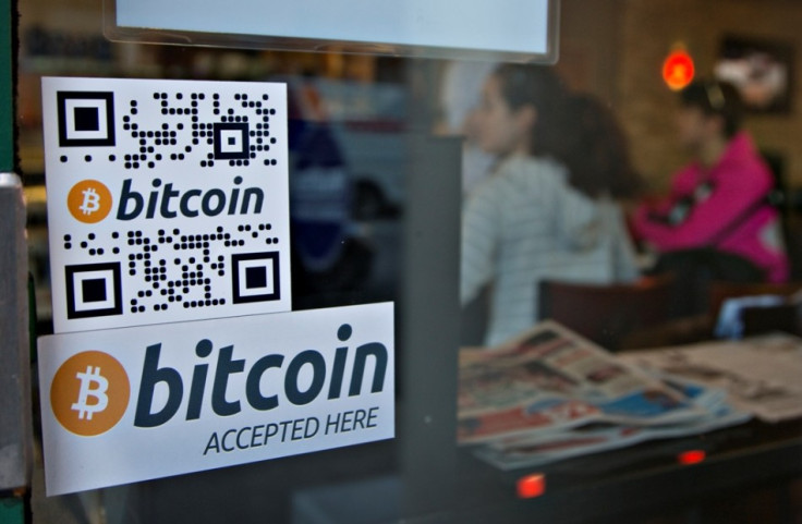 Signs on window advertise a bitcoin ATM machine