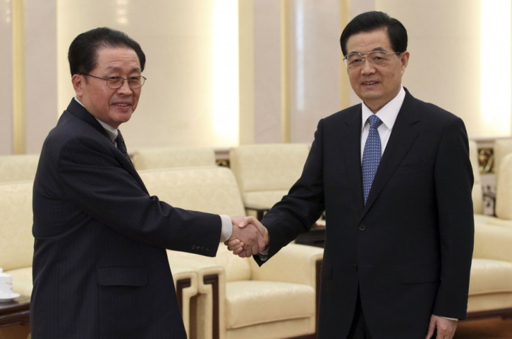 China's President Hu Jintao (R) shakes hands with Jang song-thaek, in Beijing, August 17, 2012. Thaek supported Chinese-style economic reforms and was an important link between Pyongyang and Beijing. (Reuters)