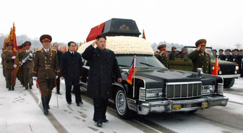 Kim Jong-un and Jang Song-thaek accompany the hearse carrying the coffin of late North Korean leader Kim Jong-il during his funeral procession in Pyongyang. (Reuters)