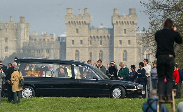 Crowds pay their respect at the Queen Mother's coffin passes