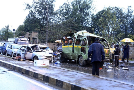 Damaged vehicles are seen at the scene of a blast near Pangani Police Station in Kenya's capital Nairobi, December 14, 2013.