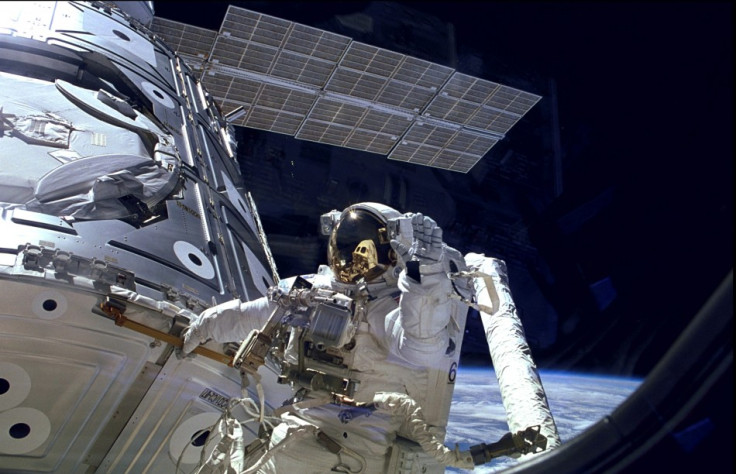 Astronaut James H. Newman waves during a spacewalk preparing for the release of the first combined elements of the International Space Station on November 20, 1998 in this image released on November 20, 2013.