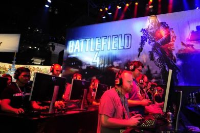 Gamers playing Battlefield 4 during E3 in Los Angeles, 2013