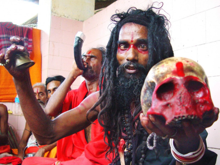 A Black Magic holyman holds a human skull at Guwahati's Kamakhya Temple, which is believed to be the highest seat of Tantra or black magic. A tantrik has been arrested for killing a woman in a human sacrifice in Mumbai. (Reuters)
