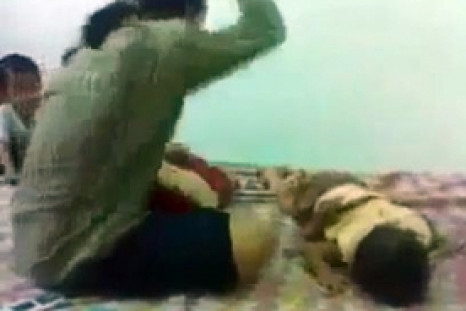 Hideous video of mother beating her 8-month-old baby