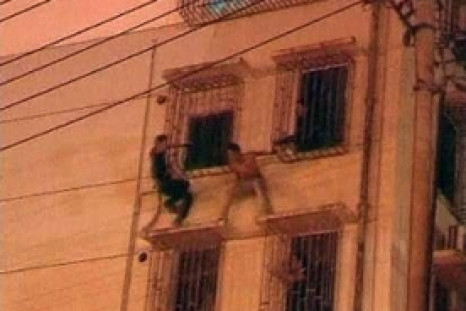 Abseiling Chinese cop swoops to thwart suicide attempt