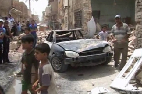 Three bomb blasts in Iraq kill at least 14 people