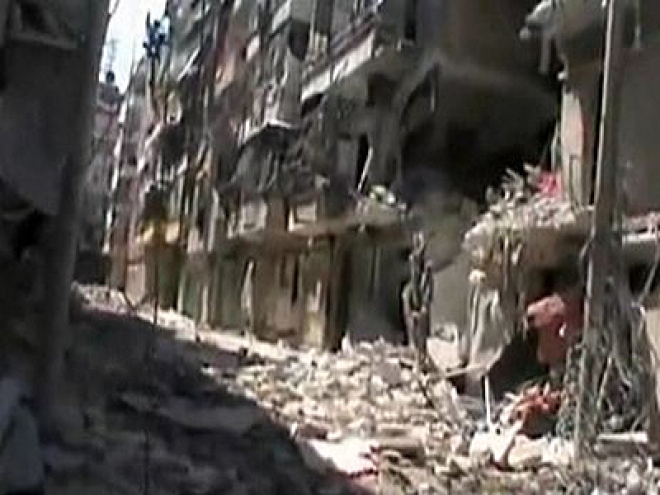 Syrian pro-Assad forces reclaim Aleppo district