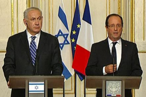 Hollande: Concrete acts 'Iran not pursuing nuclear arms'