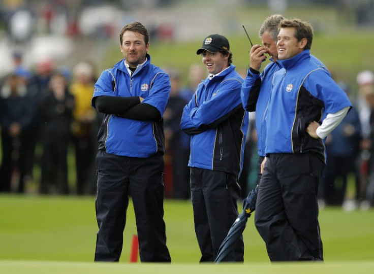 European Ryder Cup player Graeme McDowell (L) of Northern Ireland stands with teammate Rory McIlroy (2nd L), vice-captain Darren Clarke (2nd R) and Lee Westwood