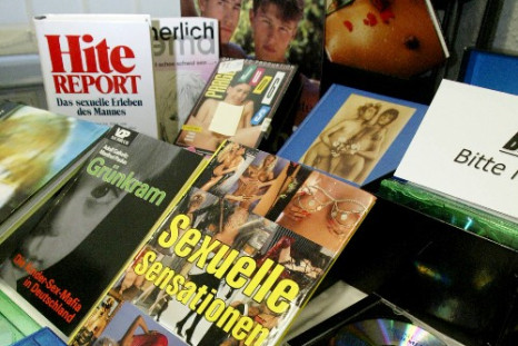 Confiscated CDs, books and video tape with child pornography content on display