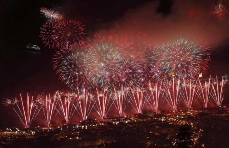 Fire works explode over Funchal Bay in Madeira island during New Year celebrations