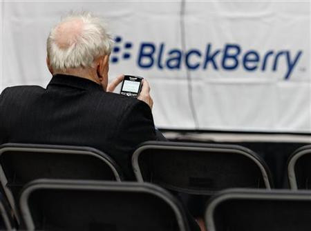 A RIM shareholder uses their Blackberry in Waterloo