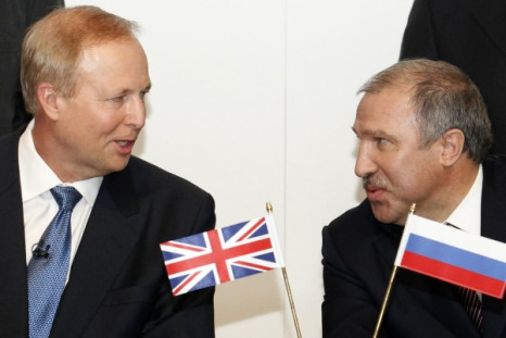 BP Chief Executive Bob Dudley speaks with Rosneft president Eduard Khudainatov before signing an agreement at BP headquarters in London
