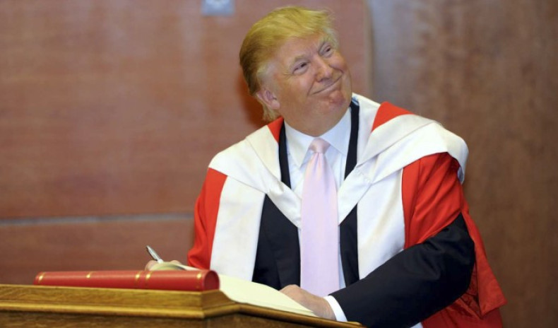 U.S. businessman Donald Trump smiles during a ceremony in which he was awarded an honorary degree, at Robert Gordon University in Aberdeen October 8, 2010.