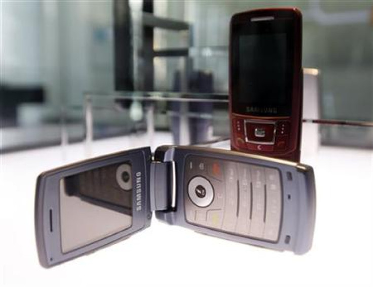 Mobile phones made by Samsung Electronics are displayed at the company's main office in Seoul.