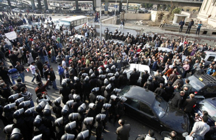 Protesters clash with riot police in downtown Cairo
