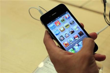 File photo of a customer looking at an iPhone 4 at the Apple Store 5th Avenue in New York