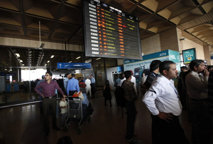 Passengers wait to get on a flight at Karachi's Jinnah International Airport