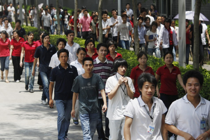 Foxconn Workers outside a factory which supplies the majority of iPhones.