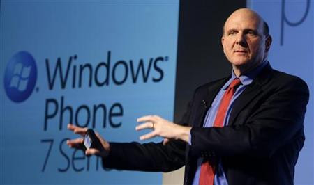 Microsoft CEO Ballmer gestures during the "Windows Phone 7" presentation at the Mobile World Congress in Barcelona