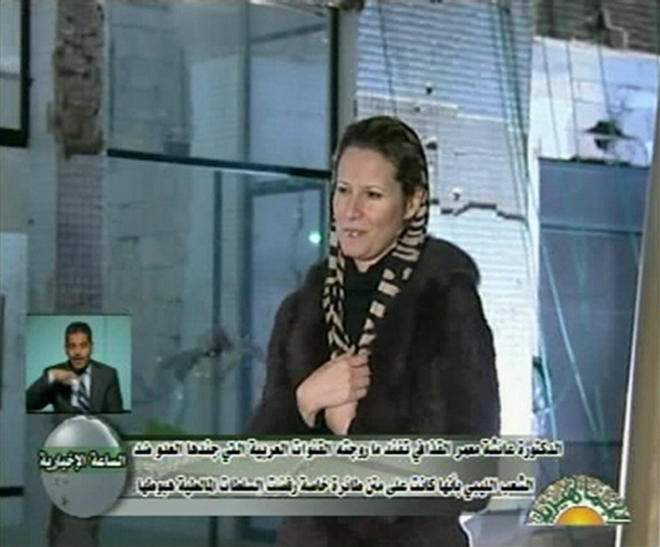 Libyan leader Muammar Gaddafis daughter Aisha speaks during an interview on state television, in this still image taken from video