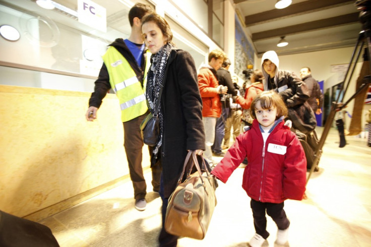 American evacuees from Tripoli disembarking from the chartered ferry that brought them out of Libya