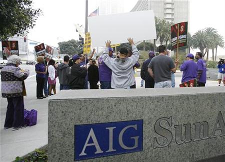 Protesters gather outside the AIG building in Los Angeles