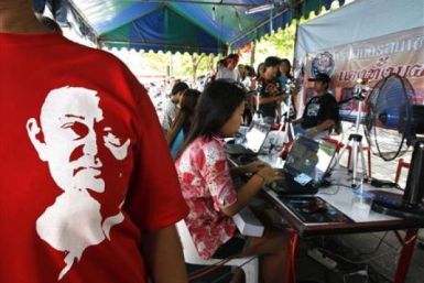 A woman wearing a t-shirt with a picture of former Prime Minister Thaksin Shinawatra