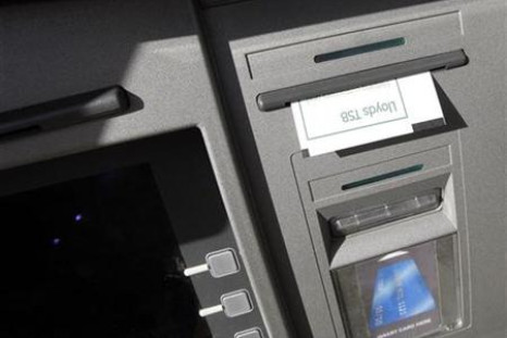 A receipt hangs from a Lloyds TSB Cashpoint machine in Loughborough
