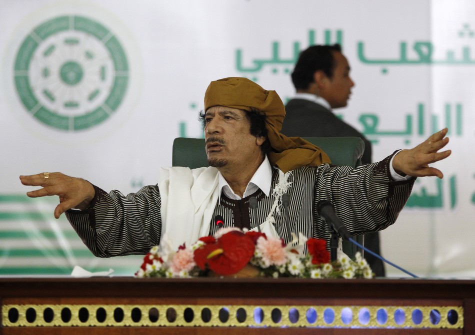 Libyas leader Muammar Gaddafi gestures to his supporters in Tripoli