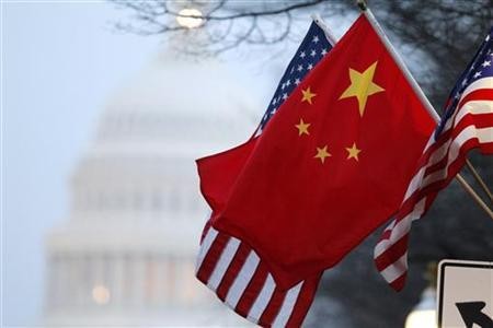 The People's Republic of China flag and the U.S. Stars and Stripes fly along Pennsylvania Avenue near the U.S. Capitol in Washington