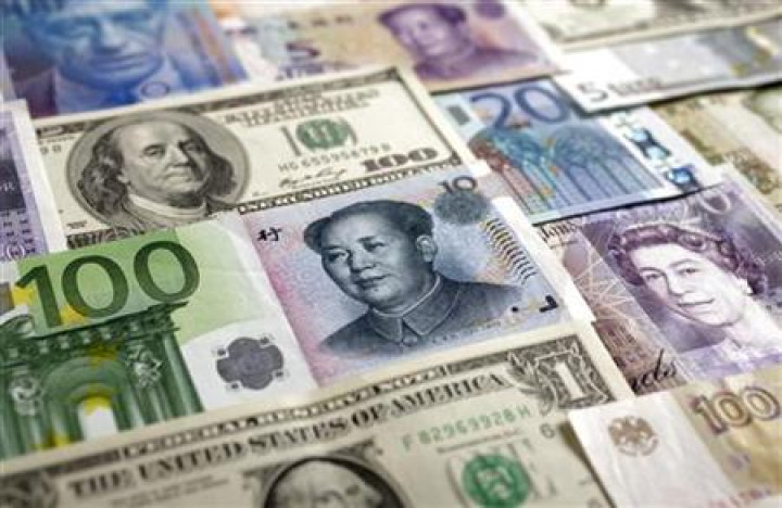 Arrangement of various world currencies including Chinese Yuan, Japanese Yen, US Dollar, Euro, British Pound, Swiss Franc and Russian Rouble pictured in Warsaw Arrangement of various world currencies including Chinese Yuan, Japanese Yen, US Dollar, Euro, British Pound, Swiss Franc and Russian Rouble pictured in Warsaw