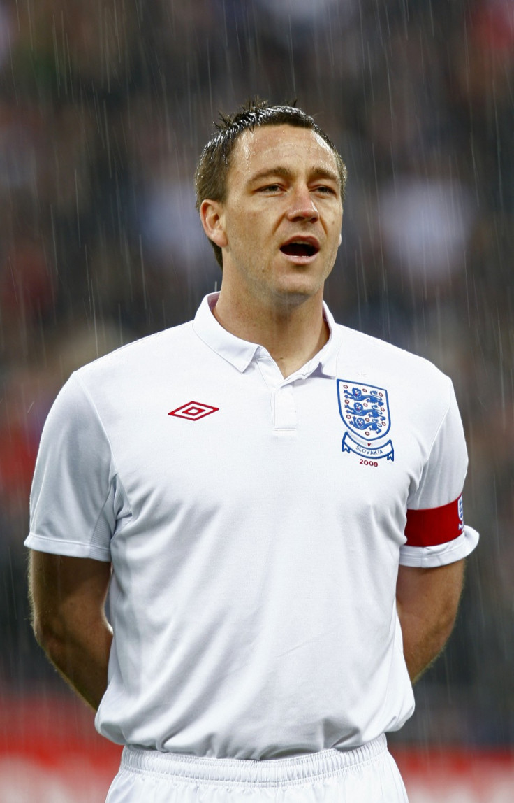 England's captain John Terry sings the national anthem in the rain before their international friendly soccer match against Slovakia in London in 2009.