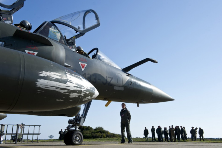A French Air Force Mirage 2000 jet make preparations at the Solenzara military air base before a mission over Libya
