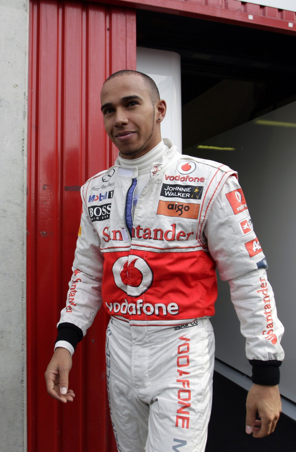 McLaren Formula One driver Lewis Hamilton qualifies pole position in Malaysia Grand Prix