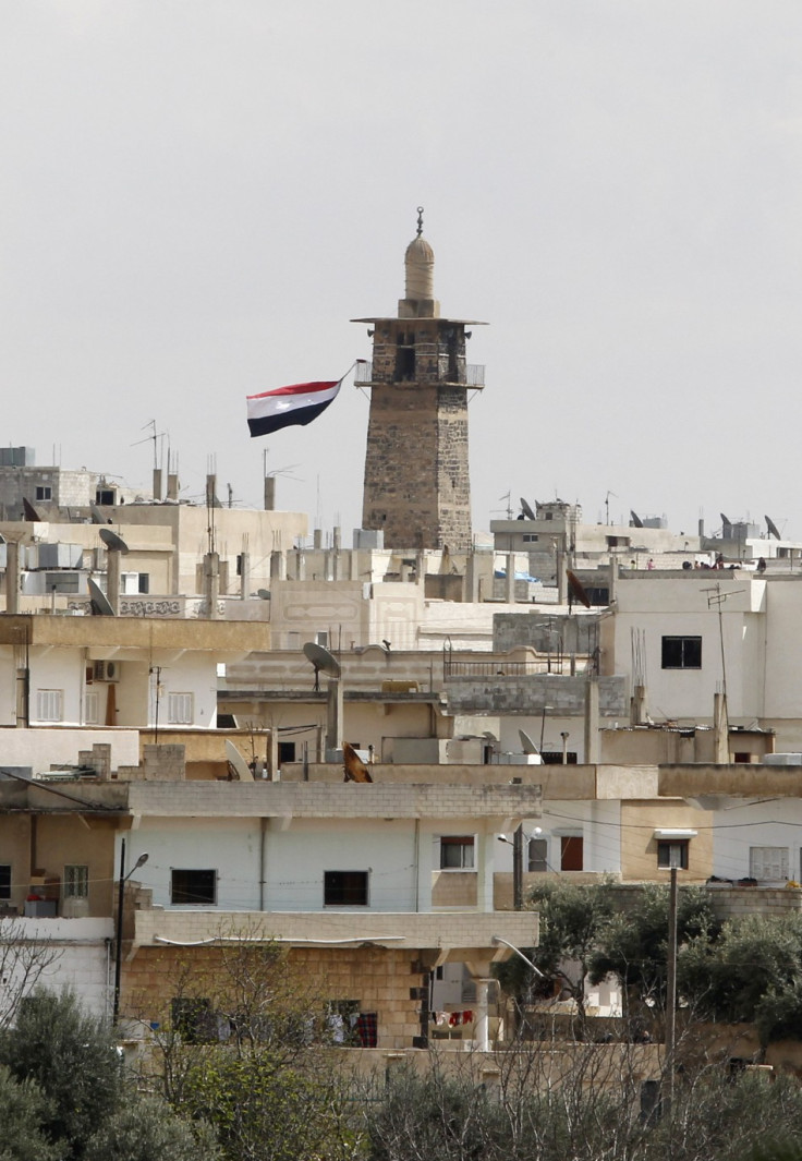 A Syrian flag flutters from the minaret of Omari mosque at the old city of Deraa March 22, 2011. A Syrian flag flutters from the minaret of Omari mosque at the old city of Deraa March 22, 2011.