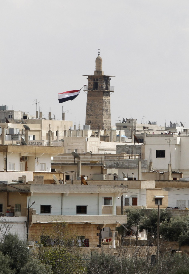 A Syrian flag flutters from the minaret of Omari mosque at the old city of Deraa March 22, 2011.