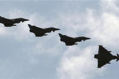 Four Italian Air Force Eurofighter EF-2000 Typhoon fly over the Birgi NATO Airbase in Trapani