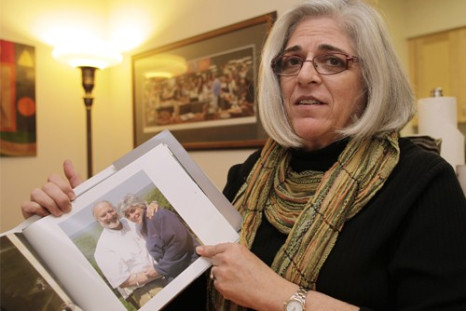 Judy Gross, wife of U.S. aid contractor Alan Gross who is jailed in Cuba, shows their family picture during an interview with Reuters at her apartment in Washington October 23, 2010