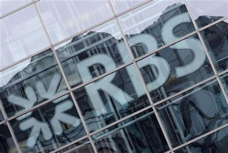 Buildings are reflected in the windows of the offices of the Royal Bank of Scotland (RBS) in the city of London