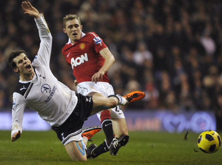 Fletcher of Manchester United tackles Bale of Tottenham Hotspur during their English Premier League soccer match in London.