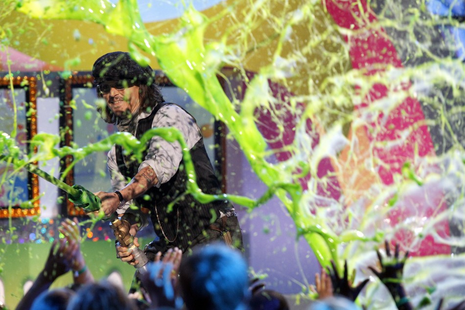 Depp, recipient of the Favorite Movie Actor award, slimes members of the audience at the 24th annual Nickelodeon Kids Choice Awards in Los Angeles