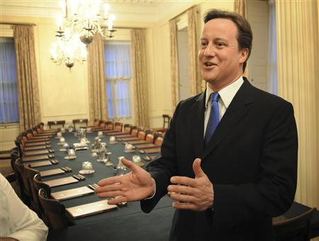 Britain's incoming Prime Minister David Cameron stands in the Cabinet Room inside 10 Downing Street in London