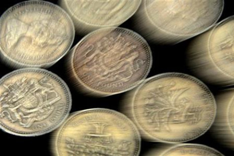 A pile of one pound coins is seen in central London