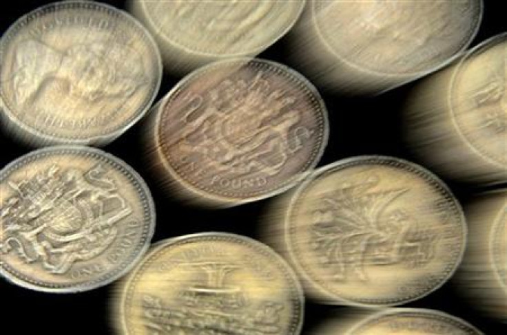 A pile of one pound coins is seen in central London