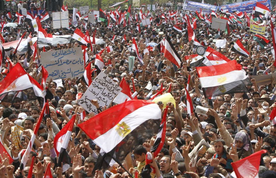 Protesters wave Egyptian flags during a protest in Tahrir square, Cairo, April 8, 2011. Tens of thousands of Egyptians protested in Cairo on Friday to press demands including the prosecution of Hosni Mubarak, voicing frustration with the military for bein