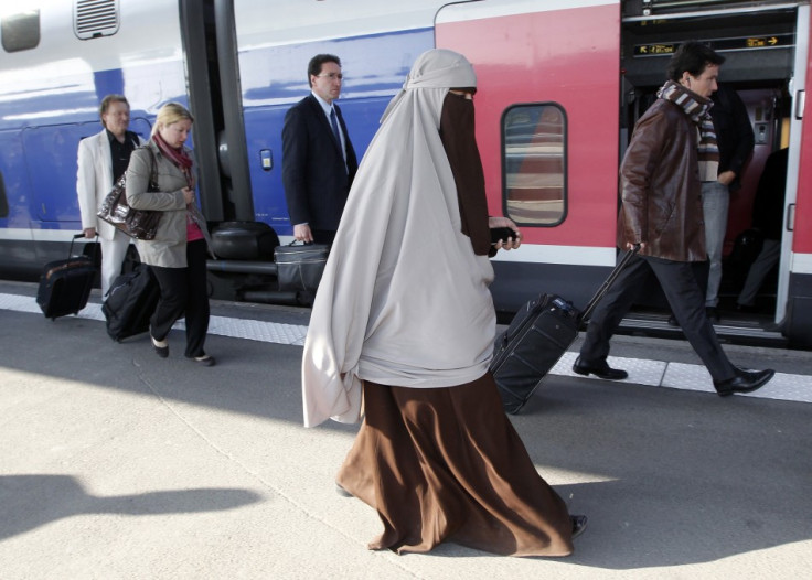 Kenza Drider, a French Muslim of North African descent, wearing a niqab, arrives at the Gare de Lyon railway station in Paris